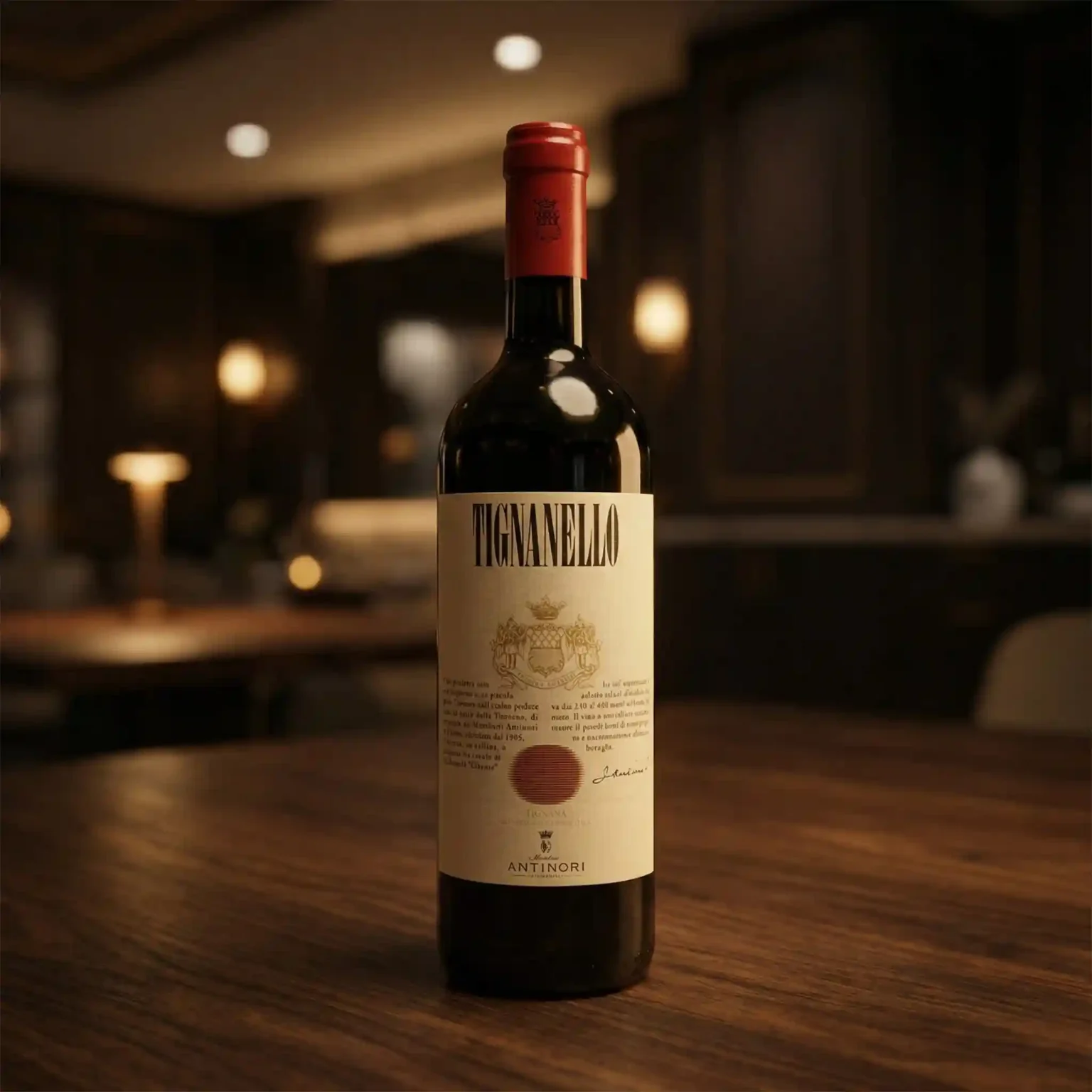 Tignanello Antinori red wine bottle standing on wooden table with warm lighting in exclusive fine dining setting.